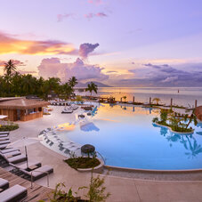 Hilton Tahiti Resort Pool and Pool bar at sunset