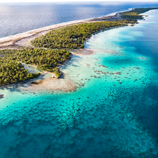 Ahe - sky view of the Island and blue clear water - Stephane Mailion
