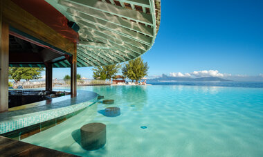 Te Moana Tahiti Pool Slide into a seat at the Swim-Up Bar at Te Moana Tahiti Resort with Moorea in the distance!
